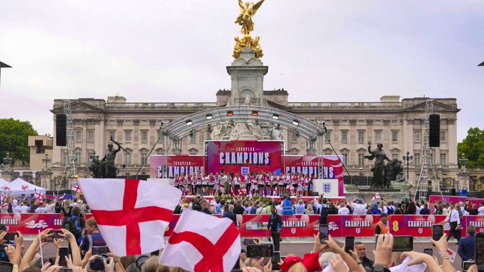 England's European champions celebrate with fans outside Buckingham Palace