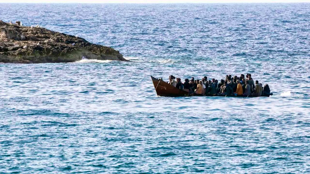 GRAPHIC - Migrants arrive at the port on the island of Lampedusa. Photo: Cecilia Fabiano/LaPresse/AP/dpa