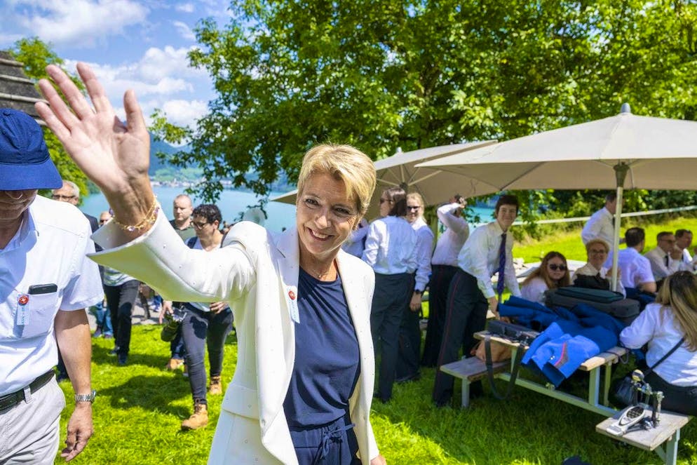 Photos from the Keystone agency show her smiling and waving to guests on the Rütli meadow before taking to the stage.