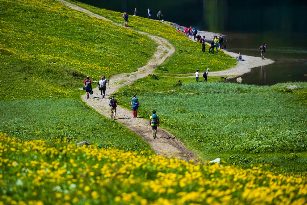 Tourists are on their way to Seealpsee, a popular excursion destination in the Alpstein mountains.