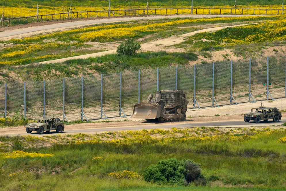 Israeli military vehicles patrol along the highly secured border with the Gaza Strip. The dividing line is symbolic of the ongoing political, territorial and humanitarian blockade and forms the backdrop to current debates on the recognition of Palestine as a state.