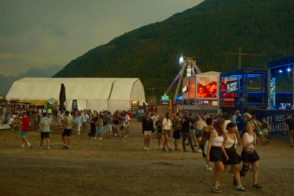 The festival visitors take the weather change in their stride.