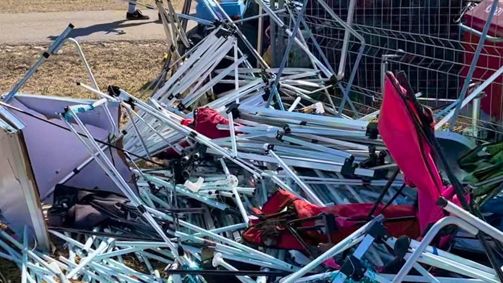 Destroyed tents are left behind.