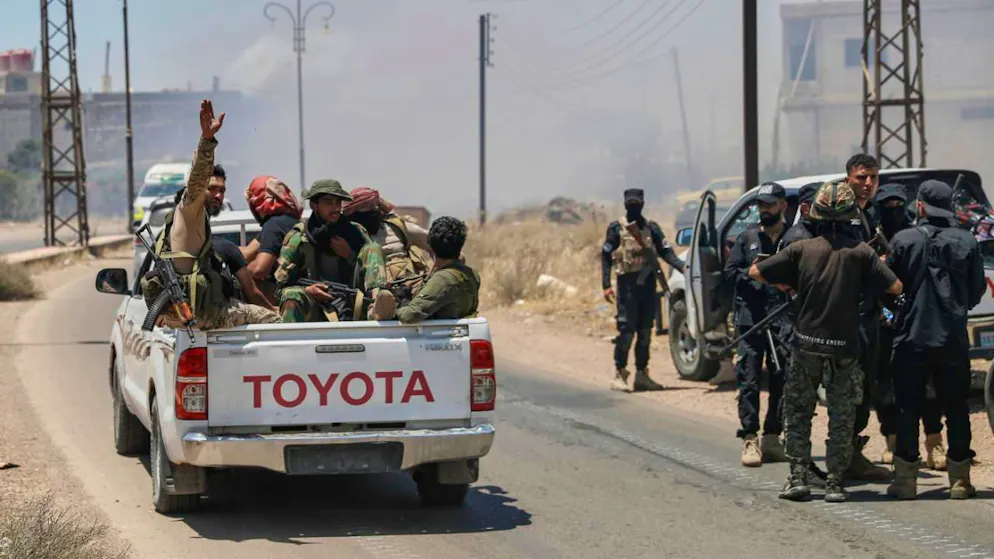 ARCHIV - Syrische Regierungstruppen sammeln sich in einem Dorf am Rande der Stadt Suweida. Foto: Ghaith Alsayed/AP/dpa