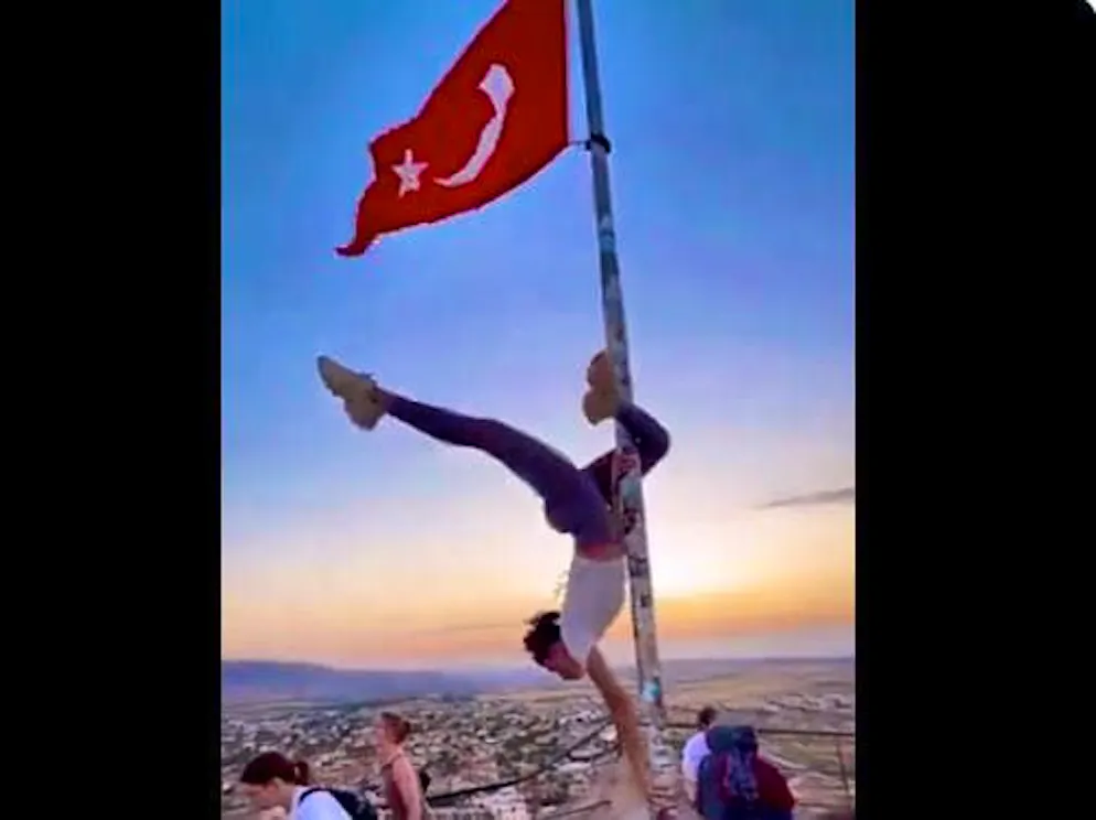 Action with consequences: Tourist performs a pole dance in the Turkish region of Cappadocia.