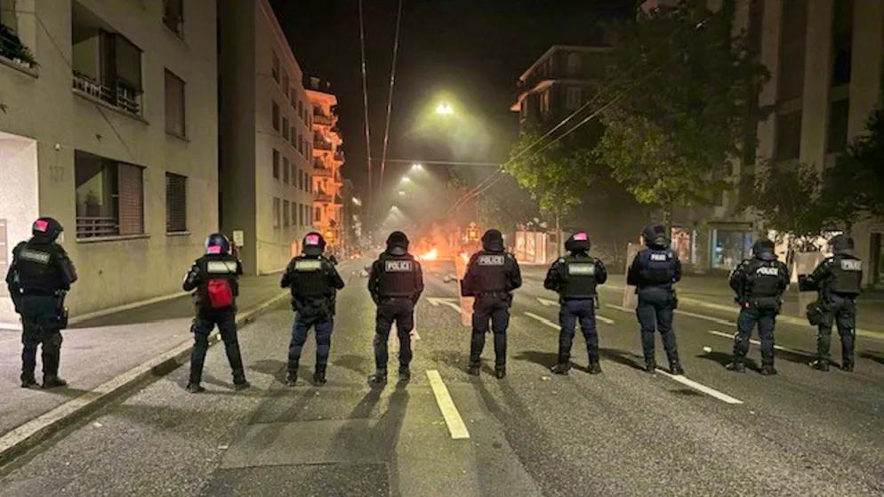 A picture released by the police shows burning garbage cans in Lausanne on Sunday evening.