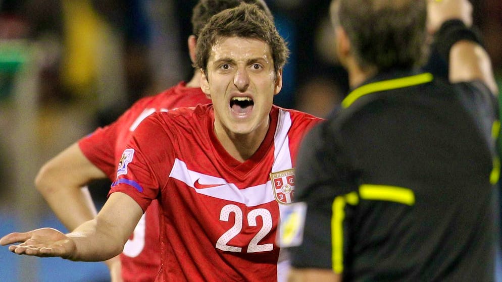 Zdravko Kuzmanovic is shown a yellow card against Ghana at the 2010 World Cup. (AP Photo/Rebecca Blackwell)