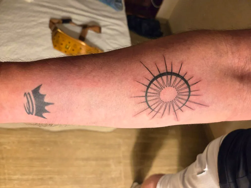 Michael and Tobias: Party weekend in Ibiza. Michael Paris has had a sun and a star engraved. It symbolizes the balance between opposing forces within himself.
