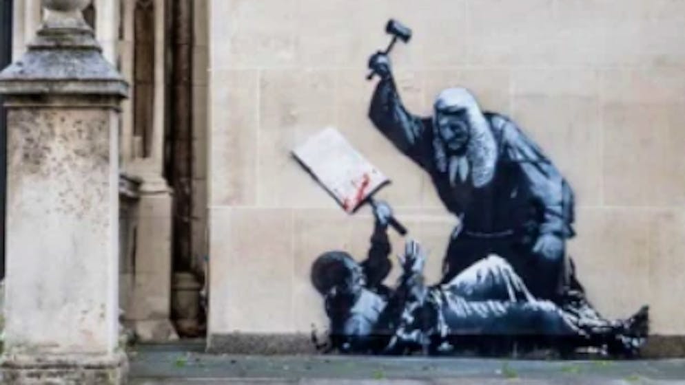 Graffiti covered up. Banksy work attacks judge - but the authorities intervene immediately
