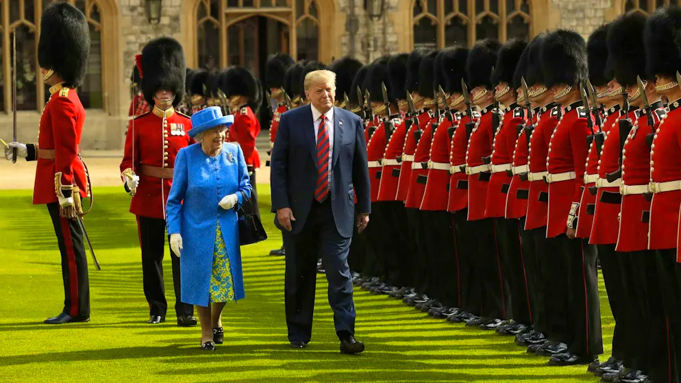 As the guards marched off, Donald Trump walked in front of Queen Elizabeth during his 2018 working visit - against court protocol.