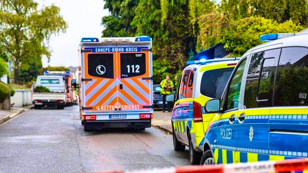 dpatopbilder - An ambulance stands in front of police cars on a street. The newly elected mayor of Herdecke, Iris Stalzer (SPD), has been found critically injured in her apartment. She had been stabbed several times, according to security sources. Photo: Alex Talash/dpa