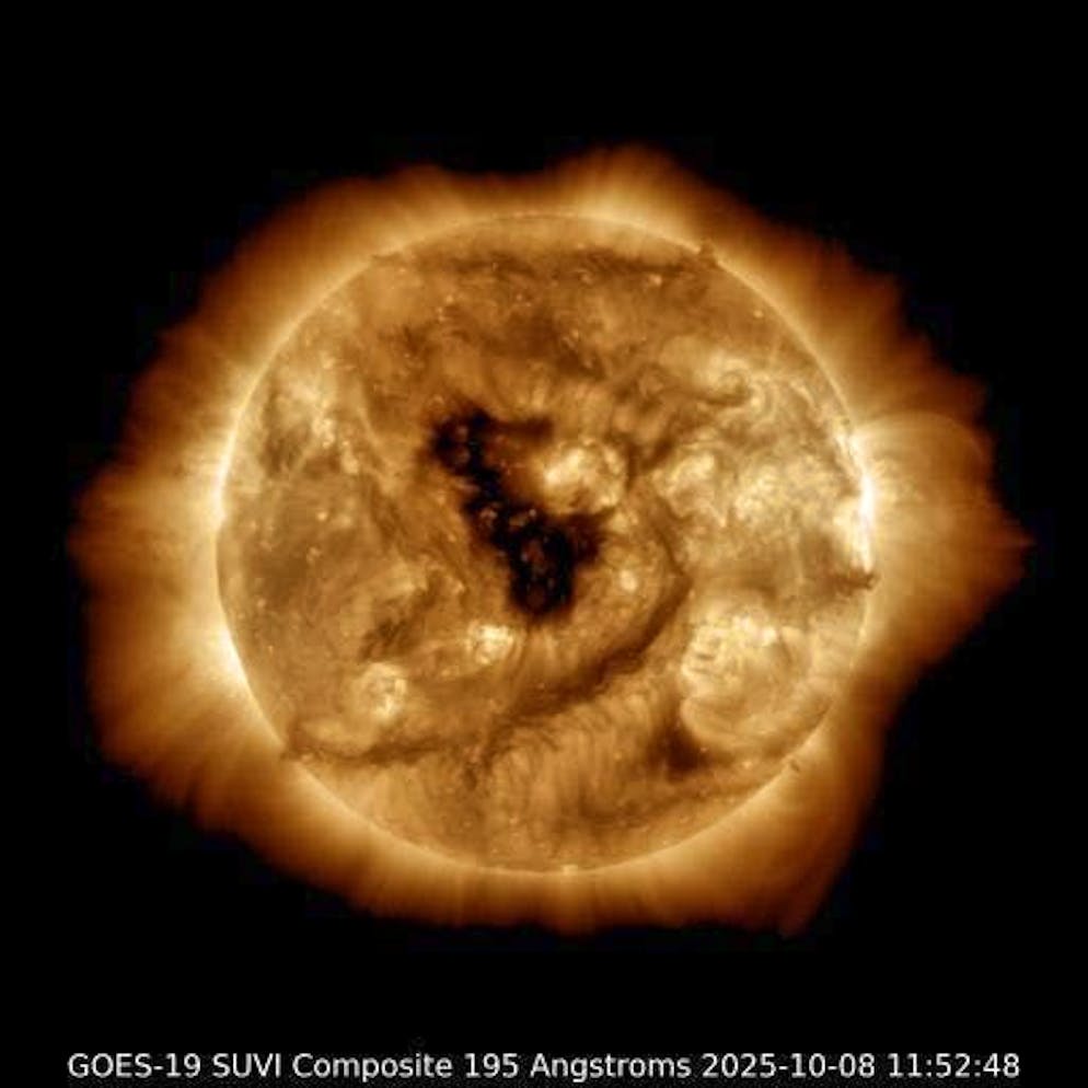 A sunspot can be seen on the surface of the sun.