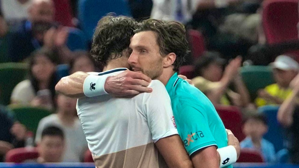 A warm hug from the cousins: Valentin Vacherot (left) sensationally wins the Masters 1000 tournament in Shanghai with a victory in the final against Arthur Rinderknech