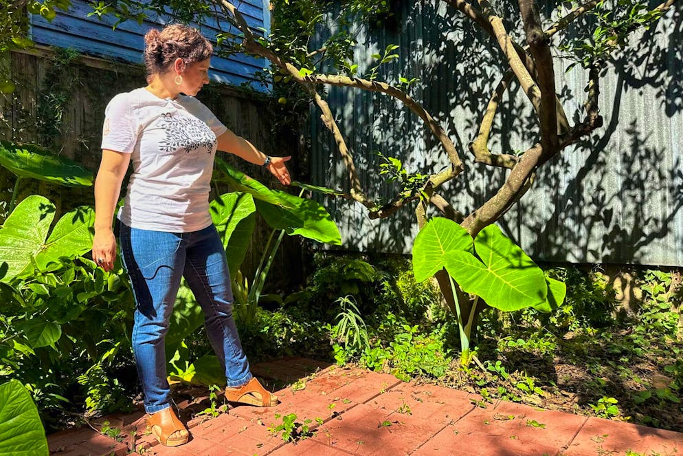 Homeowner Daniella Santoro shows the spot where her family found a 1900-year-old tombstone of a Roman sailor.