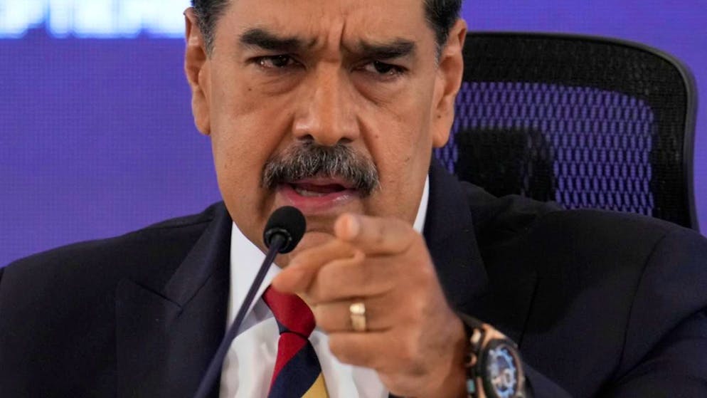 ARCHIV - Venezuelas Präsident Nicolas Maduro spricht während einer Pressekonferenz. Foto: Ariana Cubillos/AP/dpa