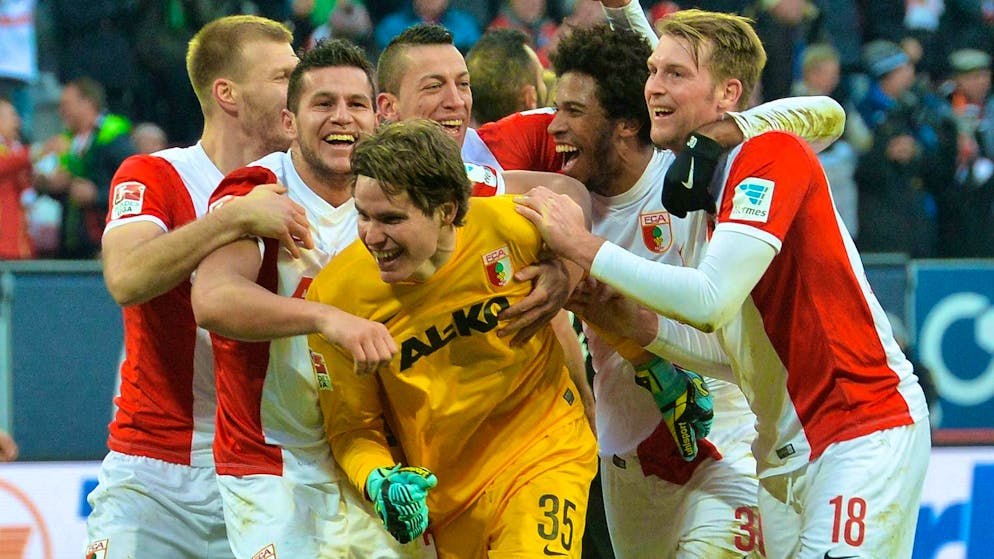 Marwin Hitz is celebrated after his goal.