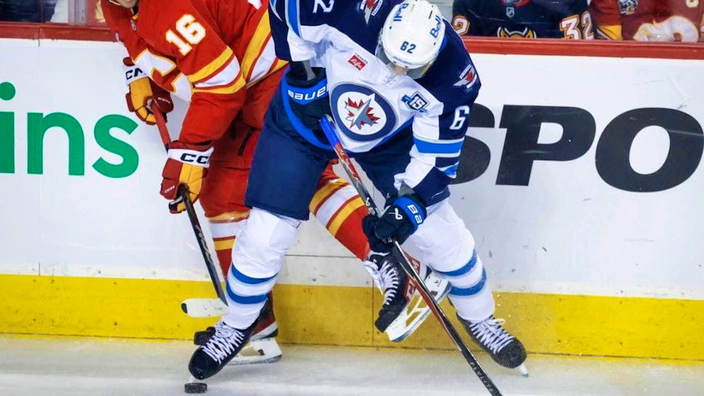Nino Niederreiter (right) holds his own against Calgary's Morgan Frost