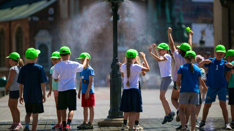 Polish children enjoy the summer in Krakow in July: their parents may soon have more money in their wallets.