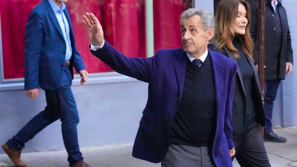 Former French President Nicolas Sarkozy and his wife Carla Bruni-Sarkozy leave their home in Paris as Sarkozy goes to prison to serve his sentence for a criminal conspiracy to finance his 2007 election campaign with money from Libya. Photo: Thibault Camus/AP/dpa