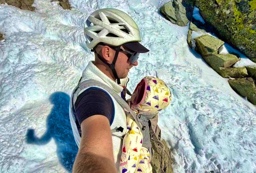 The baby was tied to a stretcher. 