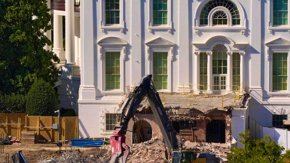 An excavator during demolition work on part of the East Wing of the White House.