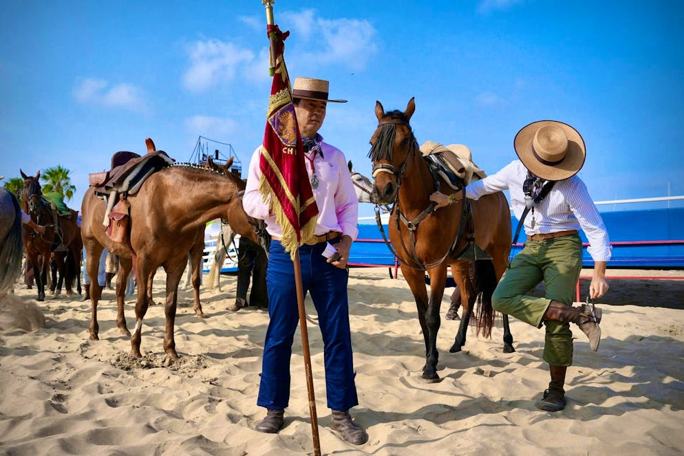 Members of the Brotherhood of Cádiz make a pilgrimage along a beach in San Lucar de Barrameda on June 3.