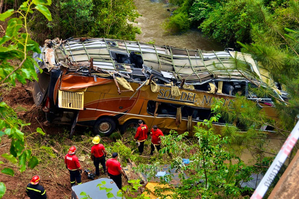 Emergency services at the scene of the accident near Campo Viera in the province of Misiones in north-eastern Argentina.