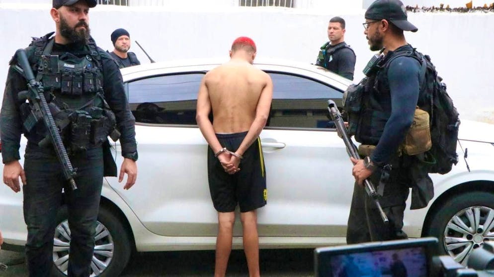A person is arrested by the police during an operation.