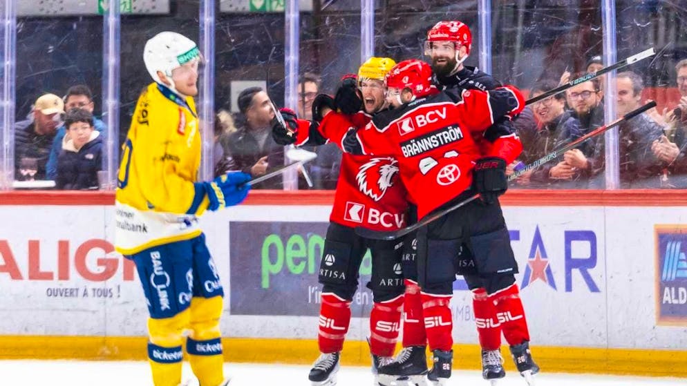 Lausanne's Austin Czarnik, Erik Brännström and Fabian Heldner celebrate the win against the leaders.
