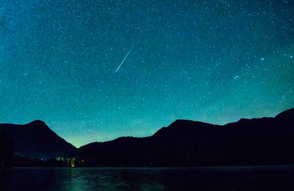 For October 31 - Sun, moon and stars in November - Shooting stars and the biggest full moon of the year. A shooting star shines alongside the Milky Way in the sky above Lake Walchensee in Bavaria. Every year, the earth crosses the path of a comet on its orbit around the sun in mid-November and the shooting stars of the Leonids appear in the night sky.