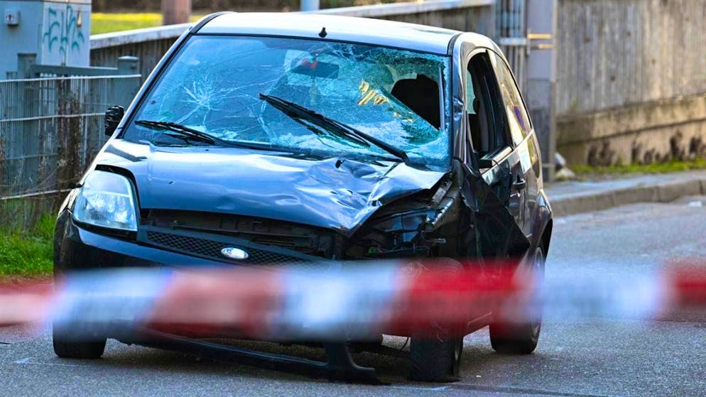 ARCHIVE - A damaged vehicle stands at an access road to the Rhine bridge. Photo: Boris Roessler/dpa
