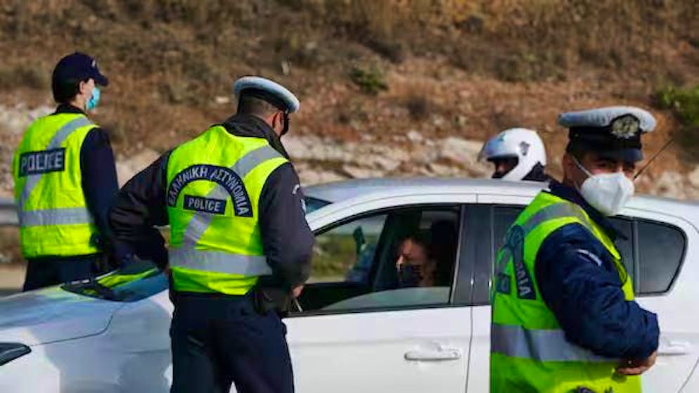 Greek police officers during a vehicle check.