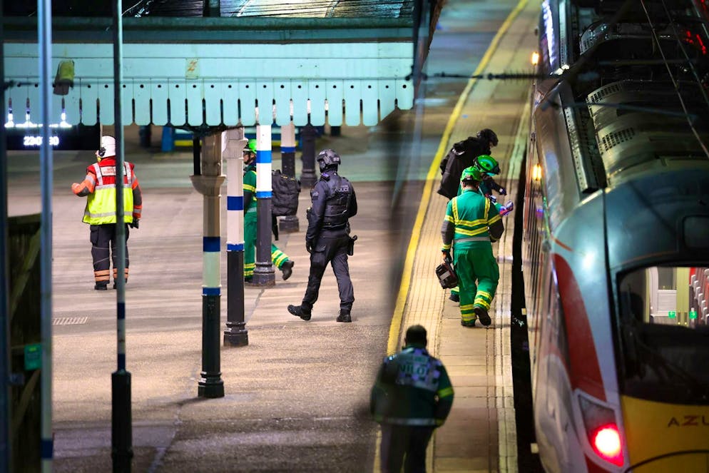 Emergency services work on the platform at Huntingdon station in England after several people were stabbed.