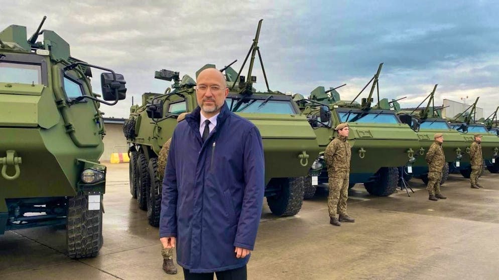 Ukrainian Defense Minister Denys Shmyhal stands at the handover of 21 Patria 6x6 armored transport vehicles to the Ukrainian armed forces at the Latvian military base in Adazi. Latvia has provided Ukraine with further military aid for the defensive campaign against Russia. Photo: Alexander Welscher/dpa
