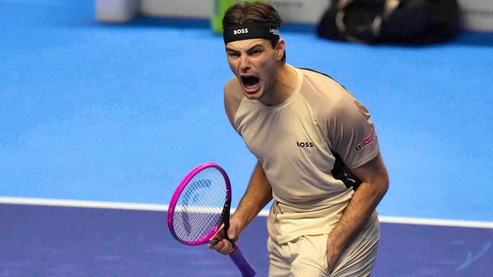 Taylor Fritz is delighted to win his first match at the ATP Finals