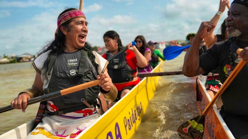 Indigenous people take part in the People's Summit event in Guajara Bay during the COP30 world climate conference. Around 200 countries negotiate for two weeks in Brazil on how to curb global warming. Photo: Joshua A. Bickel/AP/dpa