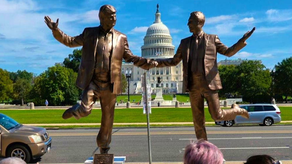 US President Donald Trump (l.) and Jeffrey Epstein - holding hands: art installation in front of the US Capitol in Washington. (October 3, 2025)