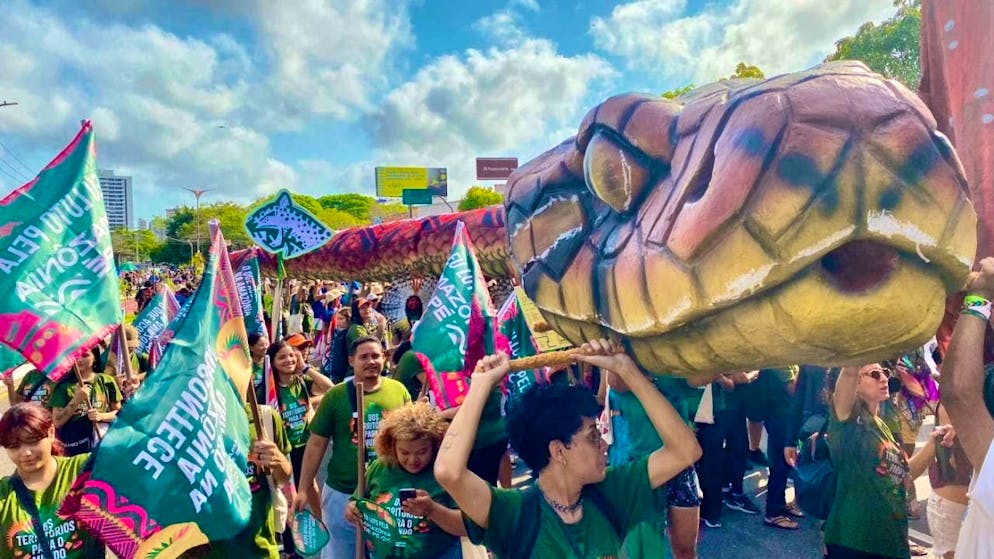 Indigenous and international climate activists have gathered for a demonstration during the COP30 climate conference. Photo: Torsten Holtz/dpa