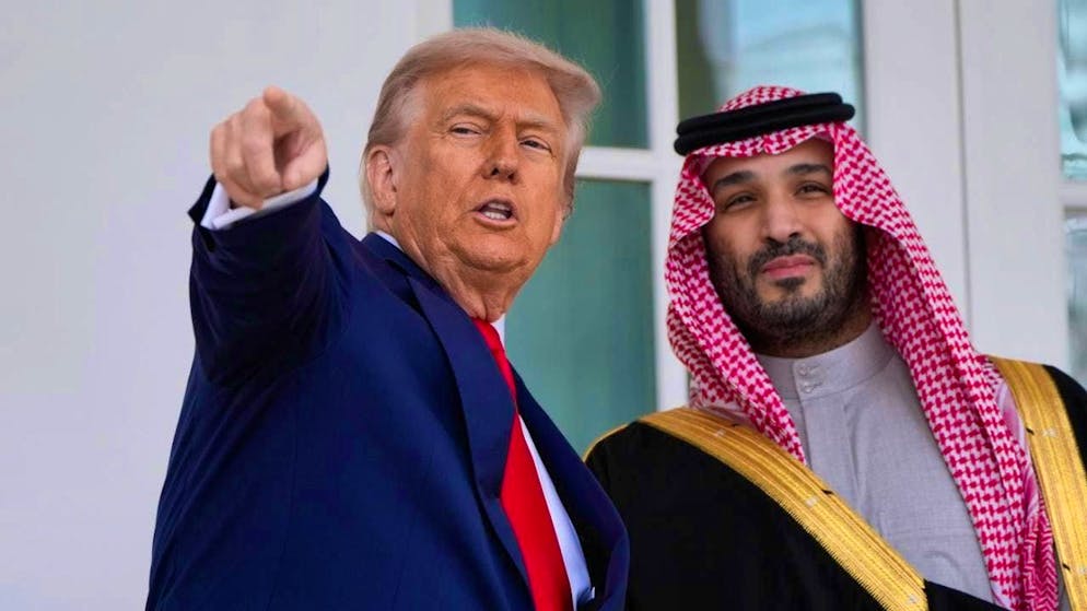 US President Donald Trump walks with Saudi Arabian Crown Prince Mohammed bin Salman along the colonnade at the White House. Photo: Alex Brandon/AP/dpa
