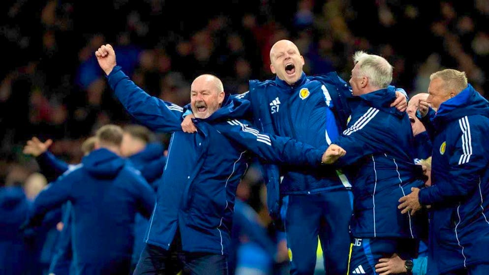 Scottish art, Austrian jubilation and the Caribbean miracle - Gallery. Head coach Steve Clarke (left) celebrates the historic win with his staff