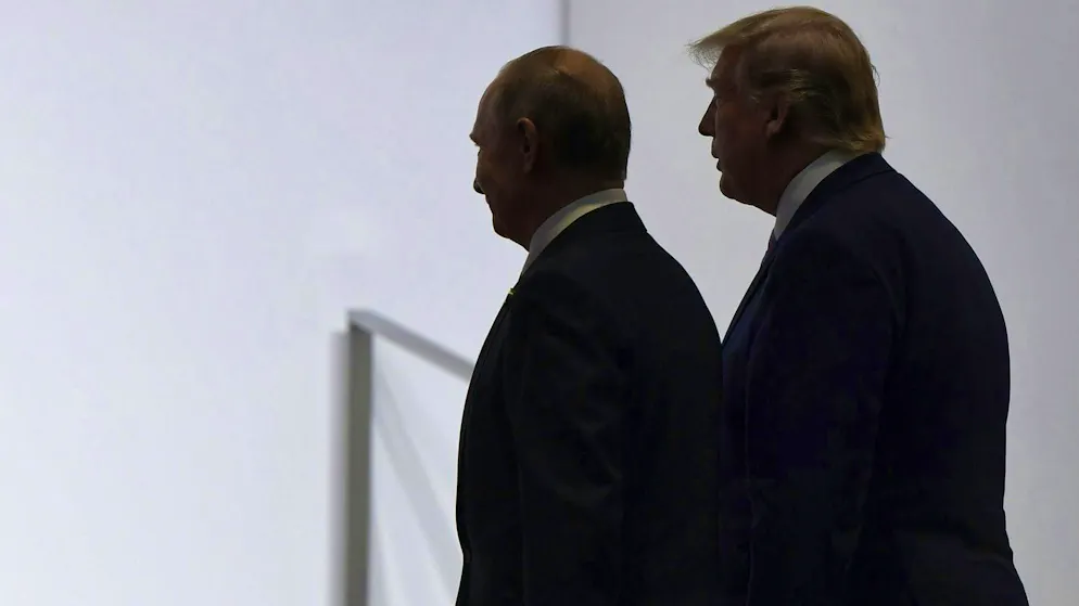 Vladimir Putin (left) and Donald Trump in Osaka, Japan, in June 2019: a report warns that Moscow is working side by side with Washington to influence the independence vote in Alberta.