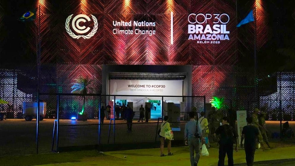 Delegates enter the COP30 climate summit venue after it was reopened following a fire the day before. Photo: Joshua A. Bickel/AP/dpa
