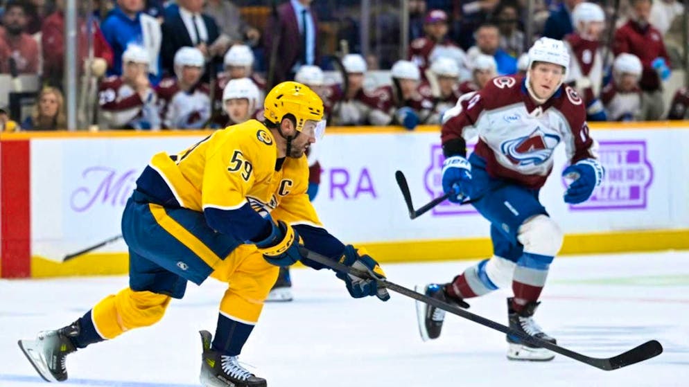 Roman Josi (in yellow shirt) is flying across the ice again.