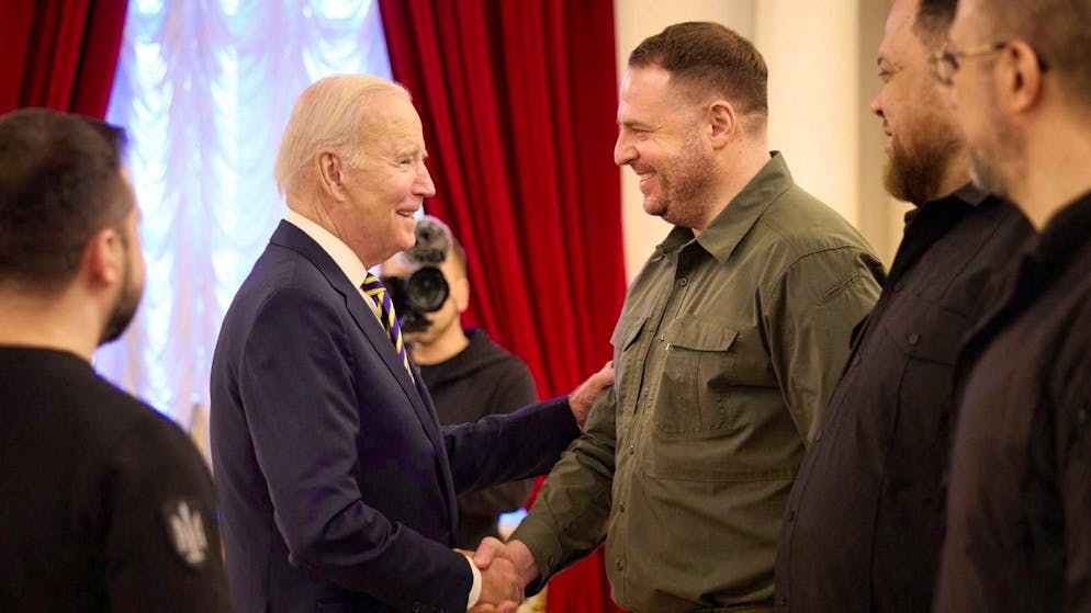 Yermak shakes hands with US President Joe Biden in Kiev on February 20, 2023.