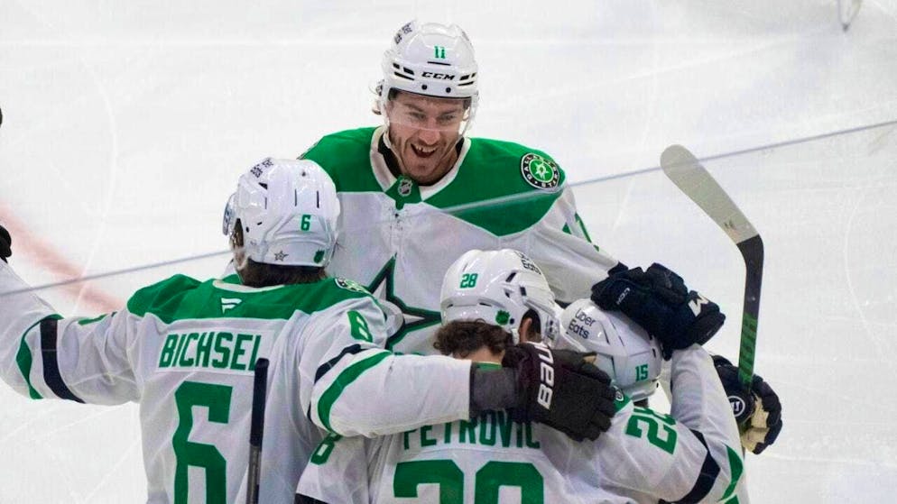Lian Bichsel (left) celebrates a resounding victory with the Dallas Stars in Edmonton