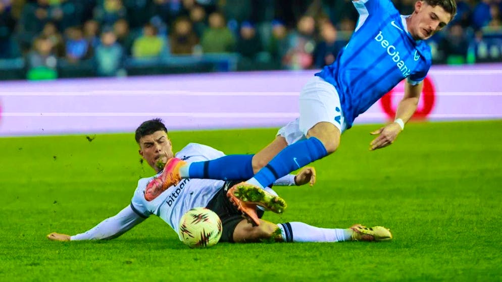 No high-flyers: Basel's Flavius Daniliuc (left) stops Robin Mirisola, but in the end the hosts Genk are jubilant in Belgium