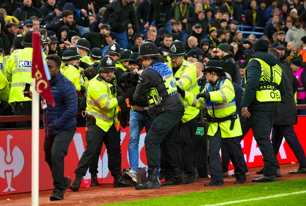 A YB supporter is taken away by the British police.