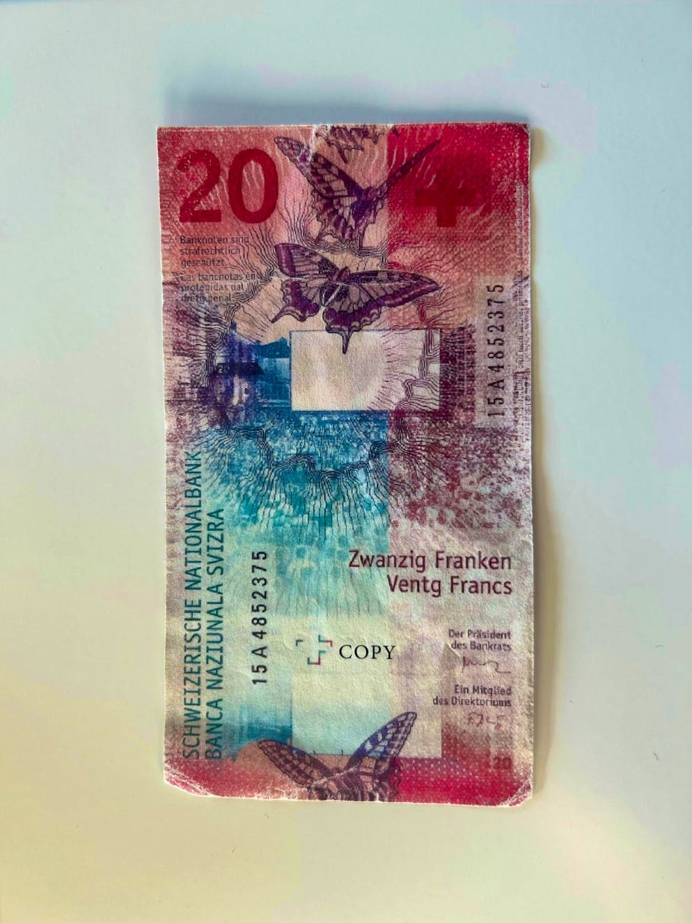 This is what forbidden counterfeit money looks like. On the back, however, it only says "Copy" in small letters.