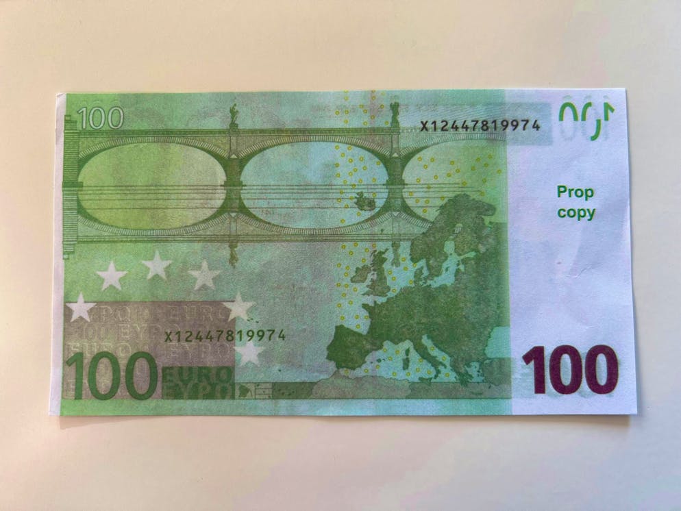 This is what forbidden counterfeit money looks like. On the back it only says "Prop Copy" in small letters.