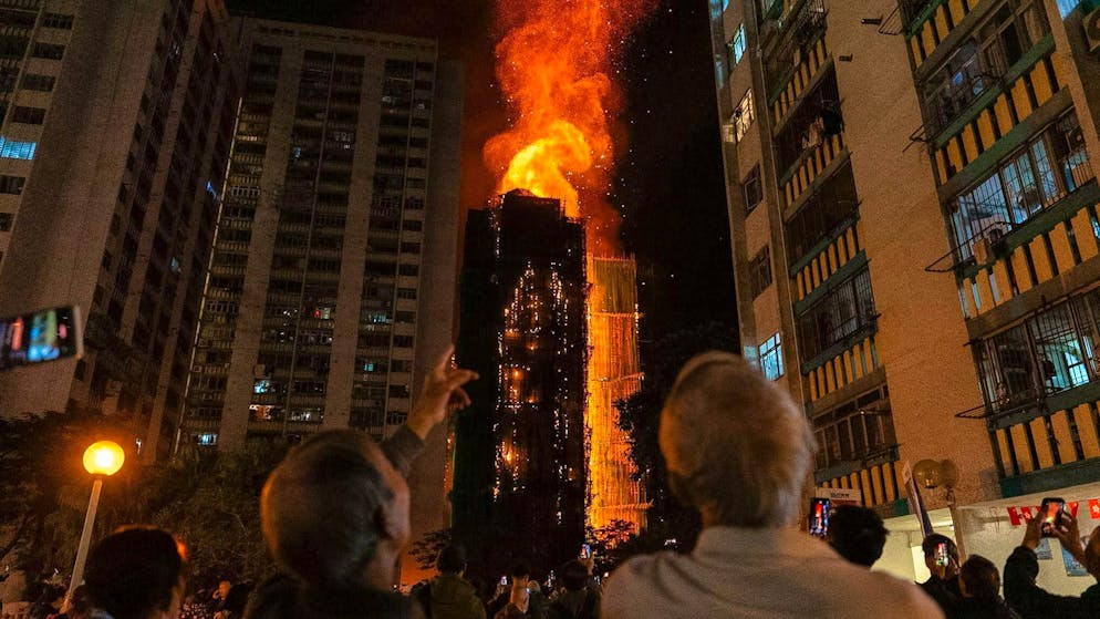 The fire spread to bamboo scaffolding and also to the interior of the high-rise buildings.